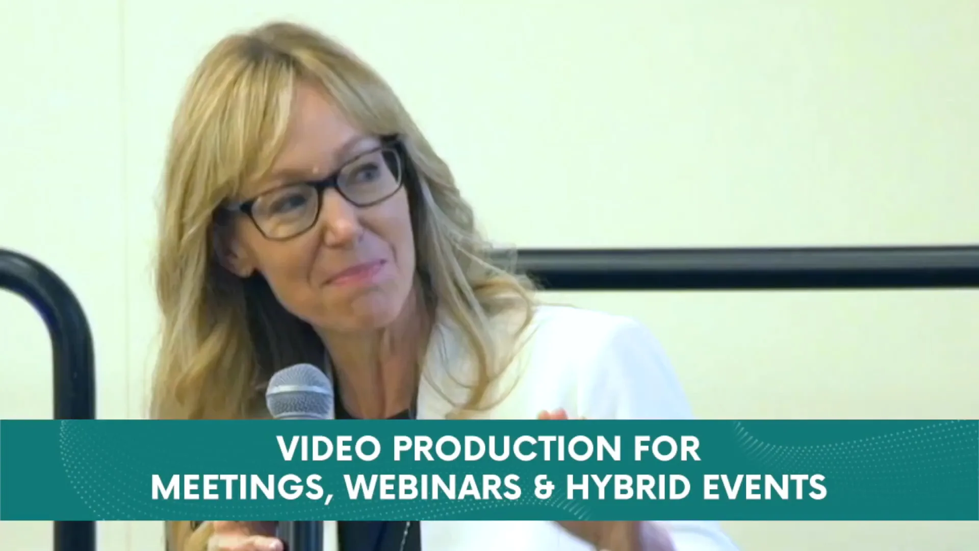 On-camera interview for a corporate video production in Michigan: speaker with microphone